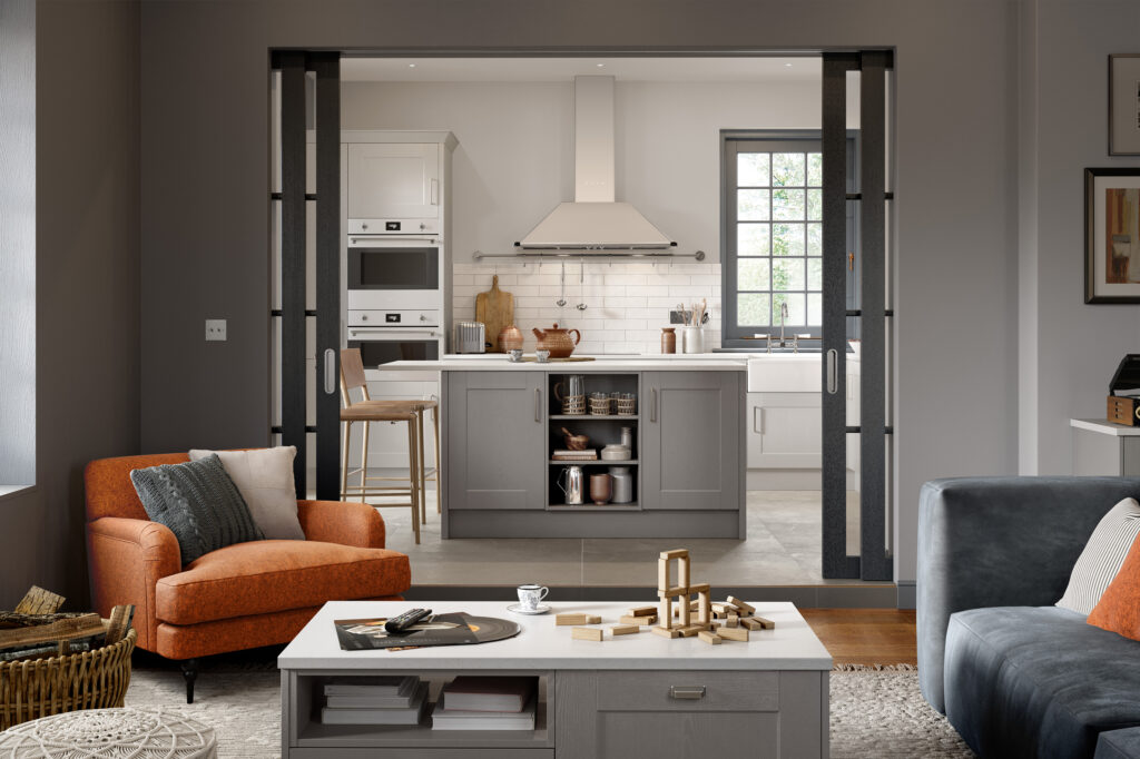 Grey two-tone Shaker kitchen with central island, walk-in pantry and glazed sliding doors.