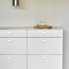 The horizon small matt white handle on a cabinet