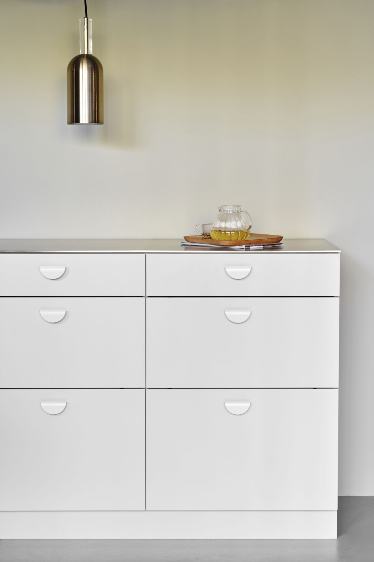 The horizon small matt white handle on a cabinet