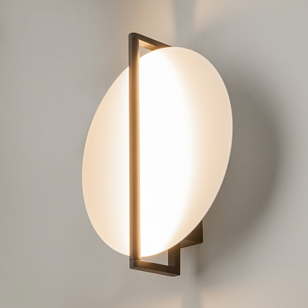 Mira black wall light with sculptural contemporary design and warm 3000K LED illumination.