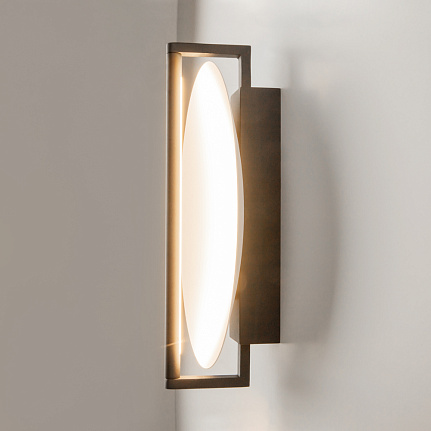 Mira black wall light with sculptural contemporary design and warm 3000K LED illumination.