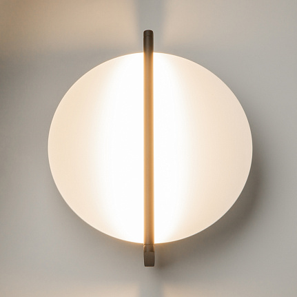 Mira black wall light with sculptural contemporary design and warm 3000K LED illumination.