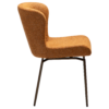 glam-swivel-chair-pumpkin-spice-boucle-w-antique-brass-legs_100208304-03-profile A side image of the Glam swivel chair in pumpkin spice with black metal legs.