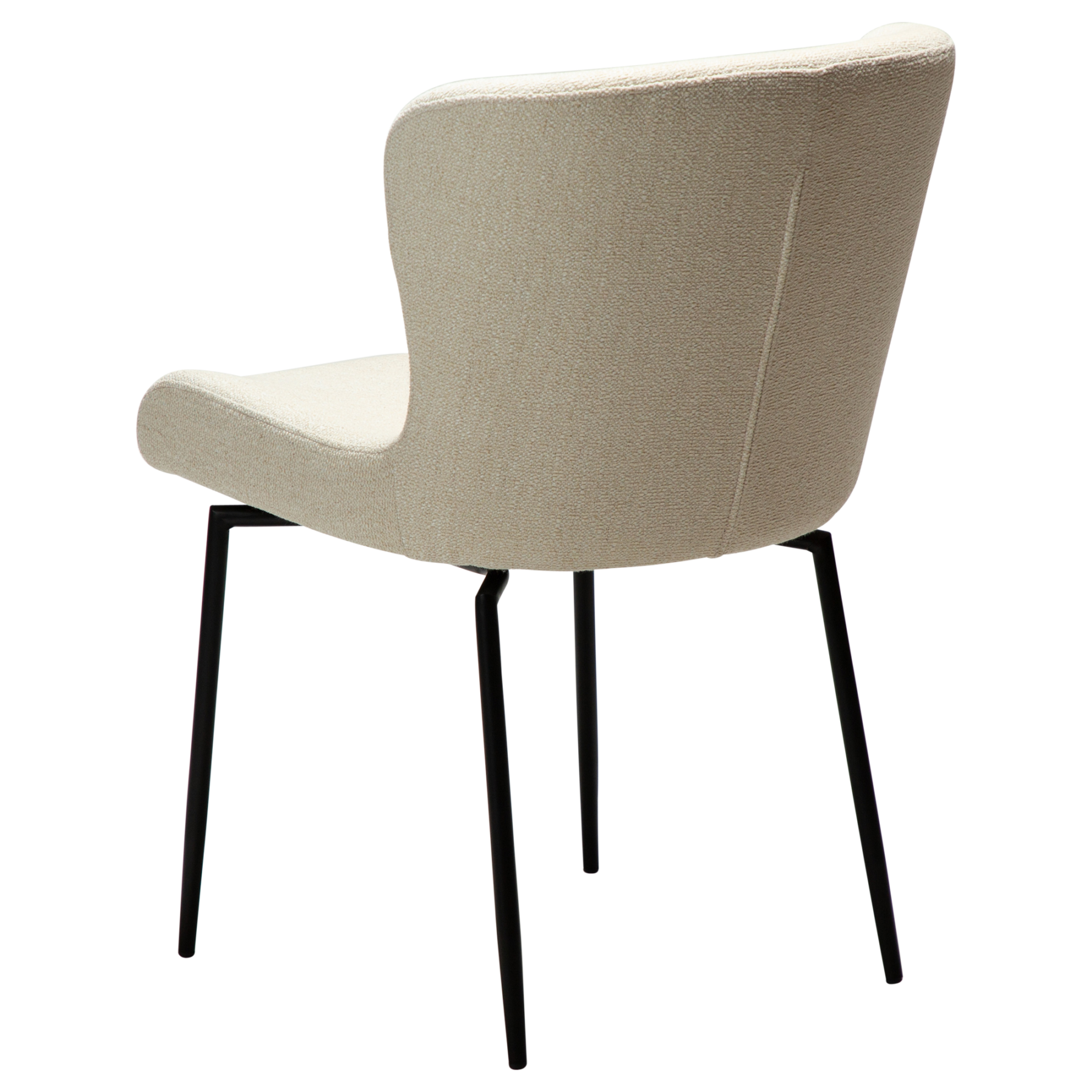 The back angle of the glam swivel chair in simply beige boucle with black metal legs.