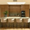 Warm Wood and Stone Kitchen with Elegant Design A striking blend of rich wood tones, textured stone, and sleek
