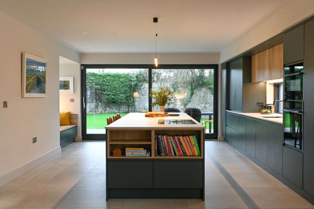 Modern green kitchen in Ireland with island and bespoke cabinetry