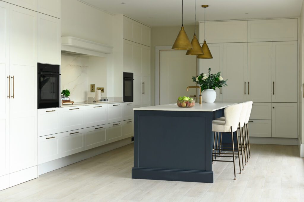 Transitional shaker kitchen with island in Tipperary featuring railings island, brass tap and pendant lighting