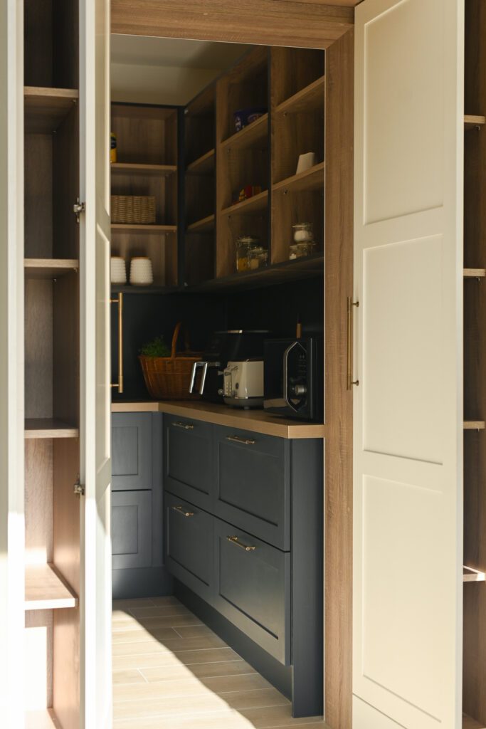 Walk-in pantry storage with open shelving and bespoke cabinetry in Tipperary kitchen