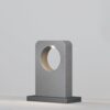 concrete outdoor landscape light with curved cut-out design, modern garden bollard lighting