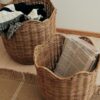 A set of 2 Lola Baskets in a living room for storage