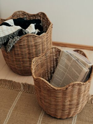 A set of 2 Lola Baskets in a living room for storage