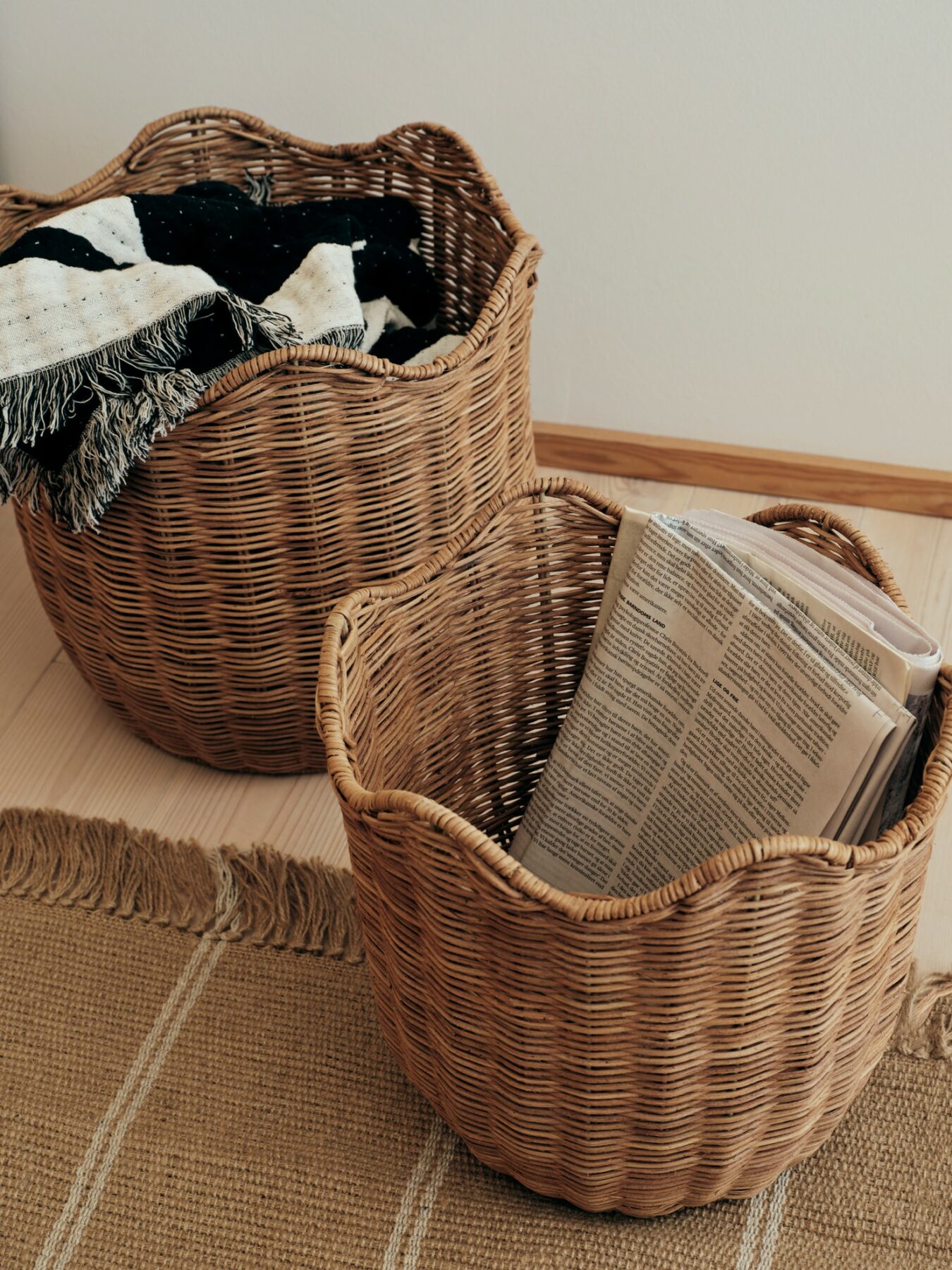 A set of 2 Lola Baskets in a living room for storage