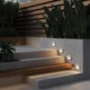 white outdoor stair light with downward glow, modern step light for pathway and steps