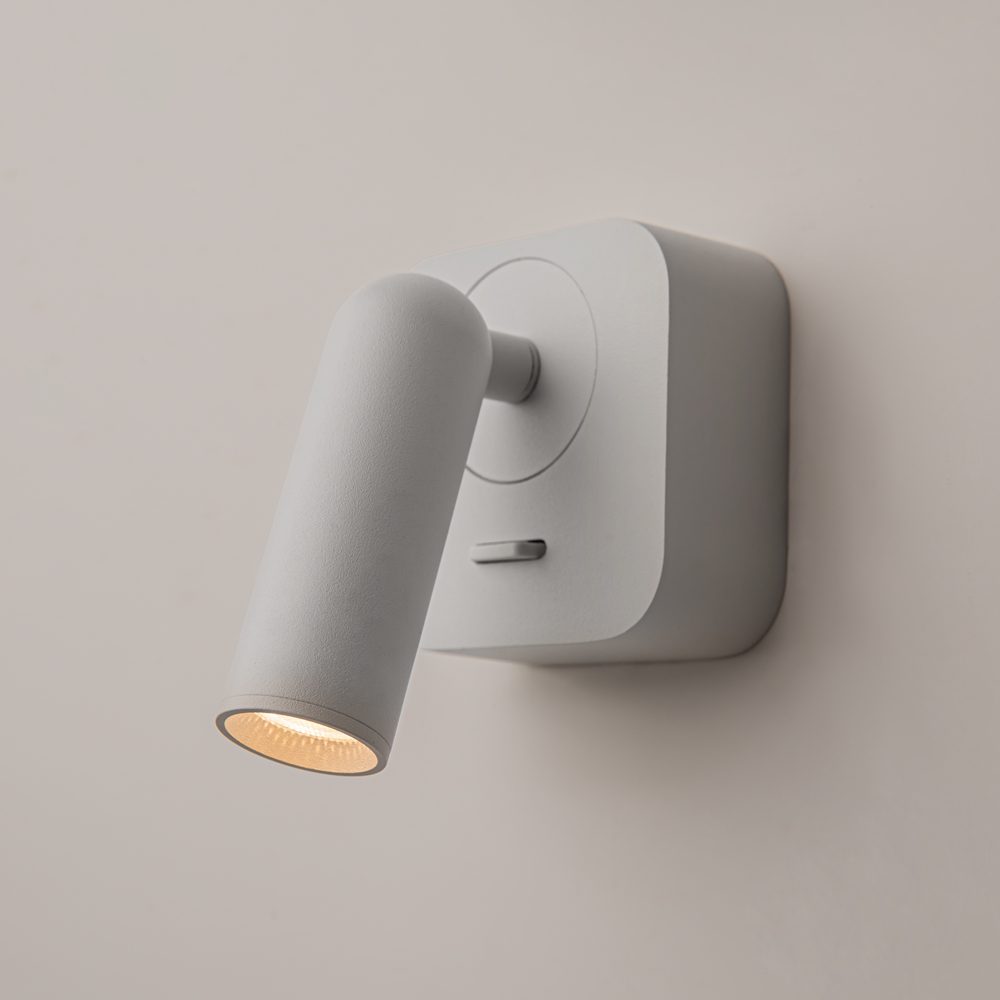 white adjustable wall reading light with focused spotlight, modern bedside wall light