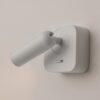 white adjustable wall reading light with focused spotlight, modern bedside wall light