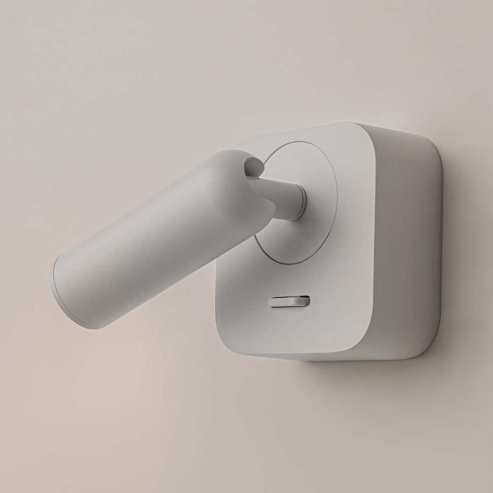 white adjustable wall reading light with focused spotlight, modern bedside wall light
