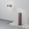 outdoor globe wall light with clear glass shade and bronze finish, modern exterior lighting