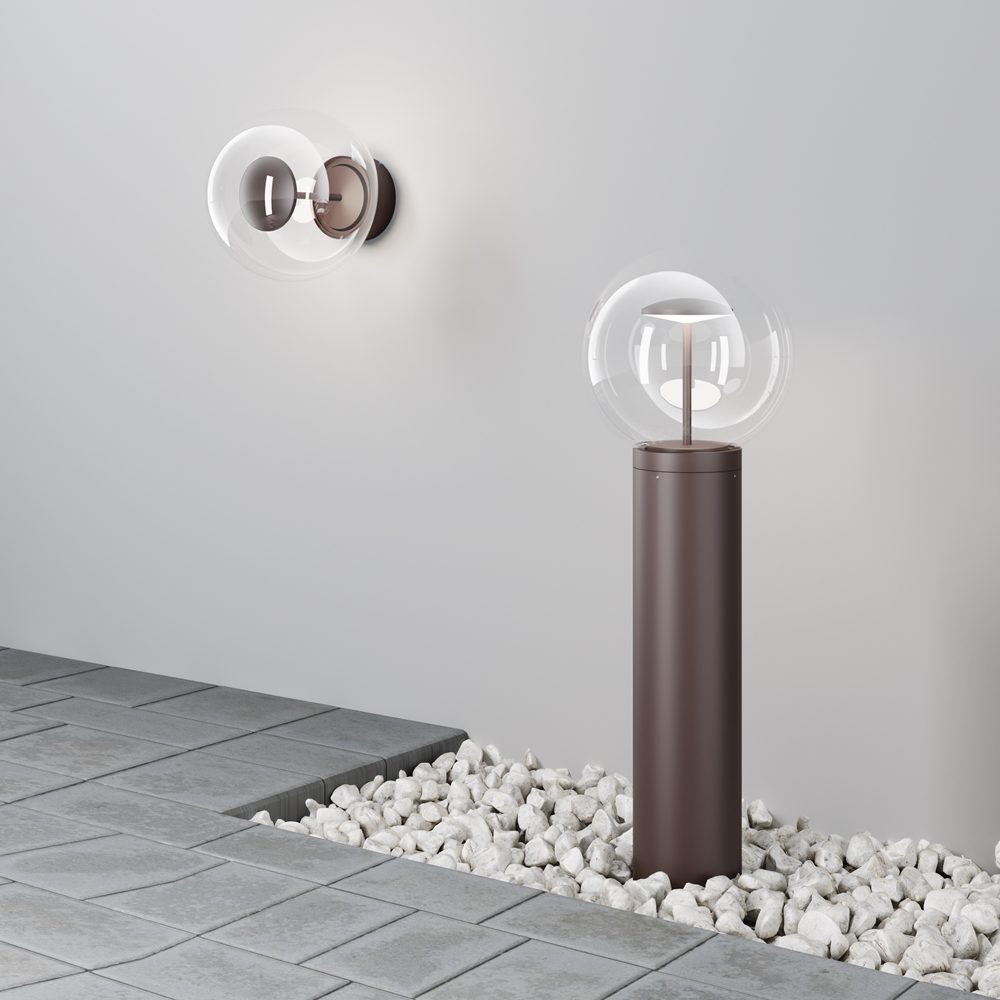 outdoor globe wall light with clear glass shade and bronze finish, modern exterior lighting