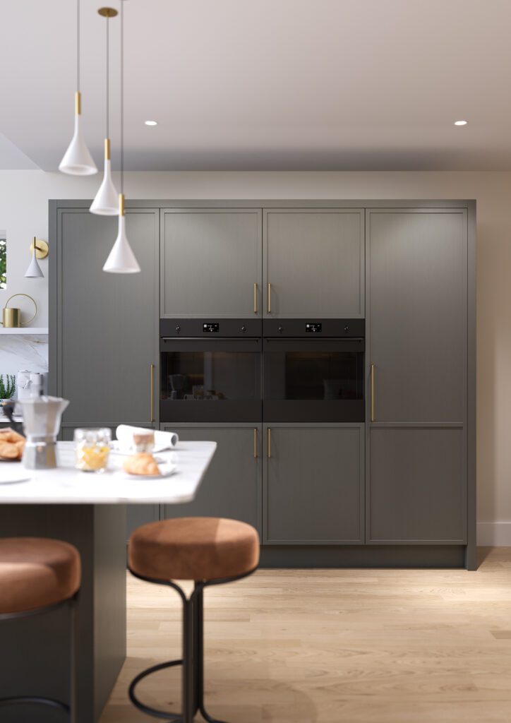 Warm grey shaker kitchen with full height cabinetry and integrated appliances in a modern home in Ireland