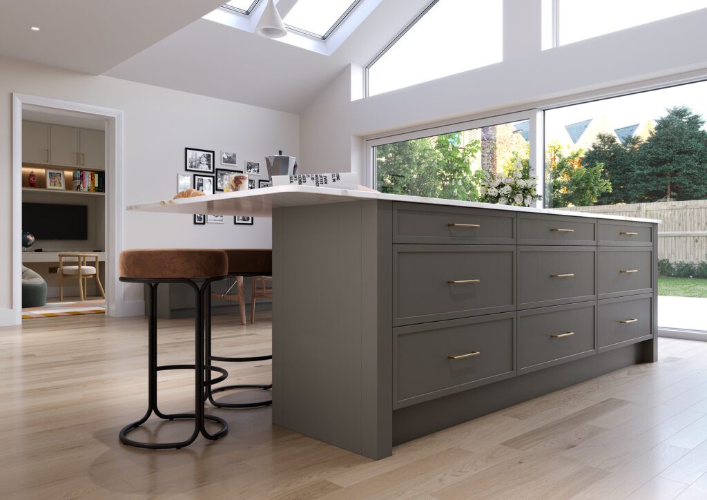 Warm grey shaker kitchen with island seating and open plan layout in a contemporary home in Ireland