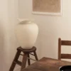 The Florentina White Vase Large sitting on a stool