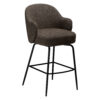 Side angle view of the Bae swivel counter stool in major brown boucle fabric with black swivel legs.