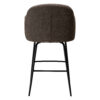 Rear view of the Bae swivel counter stool in major brown boucle fabric with black swivel legs.