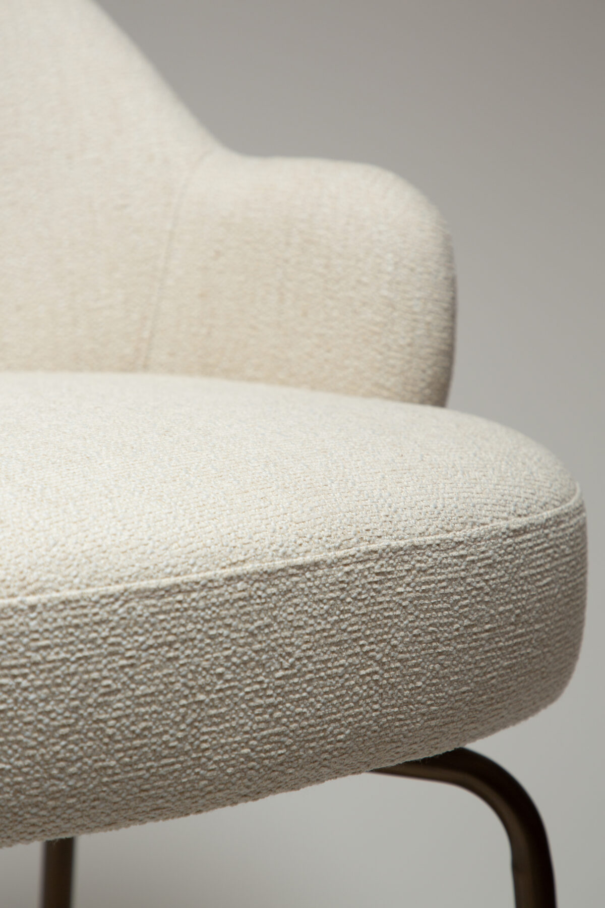 bae-swivel-counter-stool-simply-beige-bouclé-w-antique-brass-swivel-legs_300208343-07-detail2 Close up view image of the bae swivel counter stool in simply beige boucle fabric with antique brass legs
