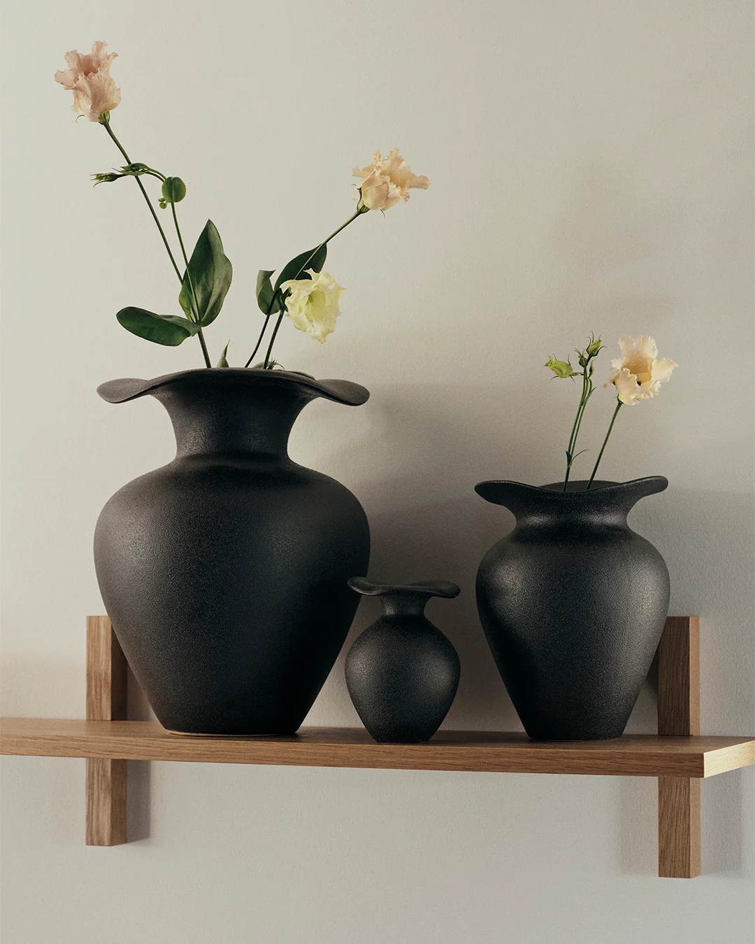 3 Florentina Black vases on a shelf