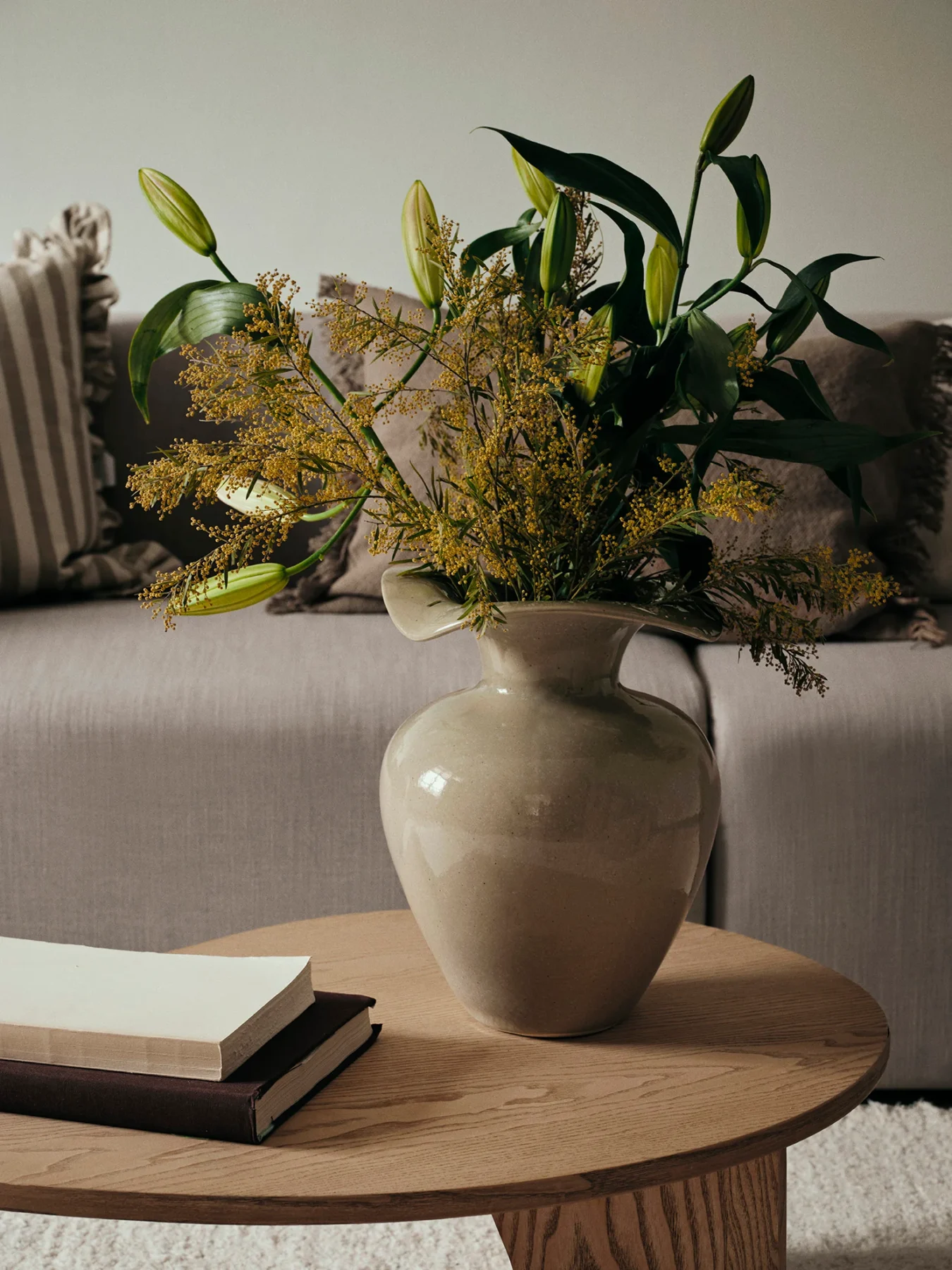 Florentina beige vasewith plants on a coffee table