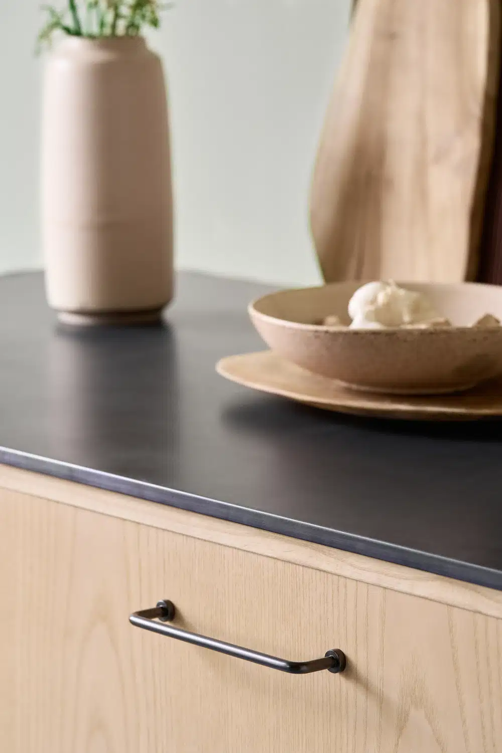 lounge-handle-gun-metal The Longe in handle in gun metal on a cabinet