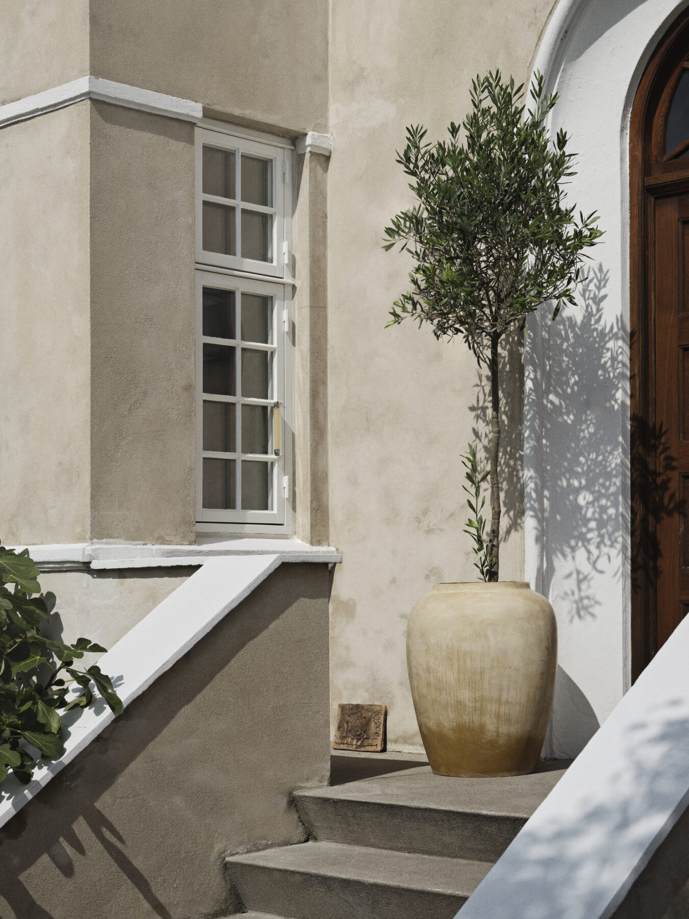 The Ray Beige Floor Vase outdoors