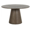 Canopus walnut oak round dining table with a central pedestal base, visible wood grain detail, and warm natural finish on a white background