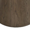 Canopus walnut oak round dining table with a central pedestal base, visible wood grain detail, and warm natural finish on a white background