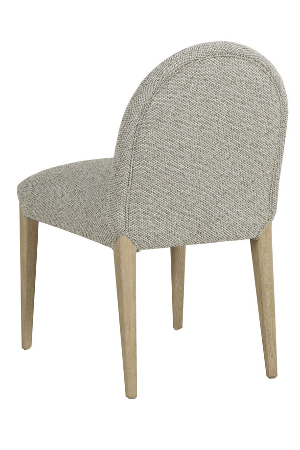 Cumbria light green and ivory upholstered dining chair with a rounded backrest, padded seat, and light oak-coloured wooden legs on a white background.