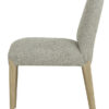 Cumbria light green and ivory upholstered dining chair with a rounded backrest, padded seat, and light oak-coloured wooden legs on a white background.