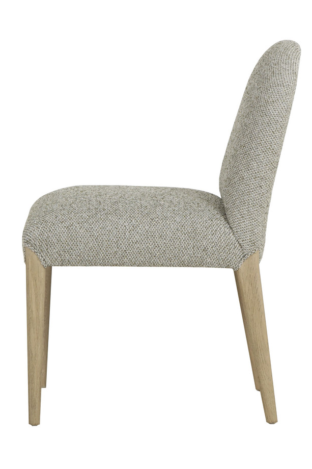 Cumbria light green and ivory upholstered dining chair with a rounded backrest, padded seat, and light oak-coloured wooden legs on a white background.