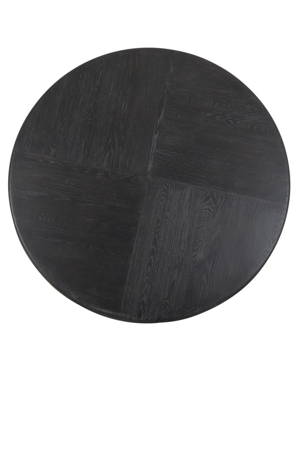 Diros black round dining table with a sculptural open base, visible wood grain detail, and modern dark finish on a white background.
