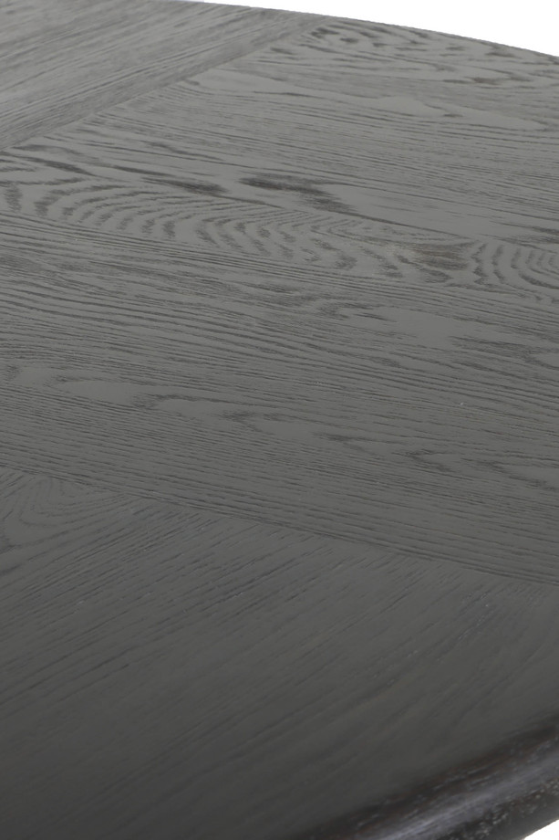 Diros black round dining table with a sculptural open base, visible wood grain detail, and modern dark finish on a white background.