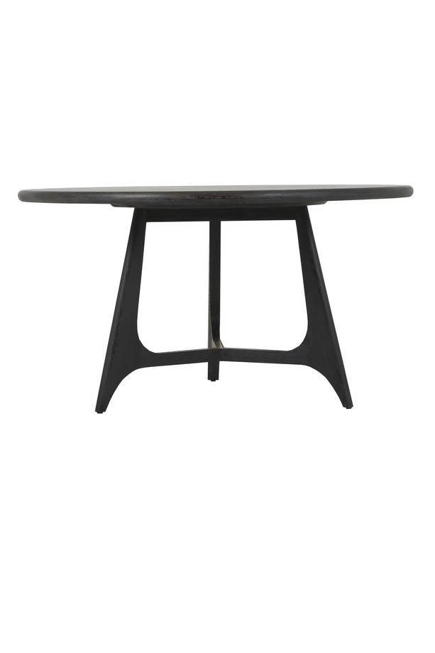 Diros black round dining table with a sculptural open base, visible wood grain detail, and modern dark finish on a white background.