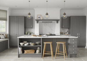 Traditional dust grey shaker kitchen with large island, breakfast seating, marble-effect worktops and pendant lighting.