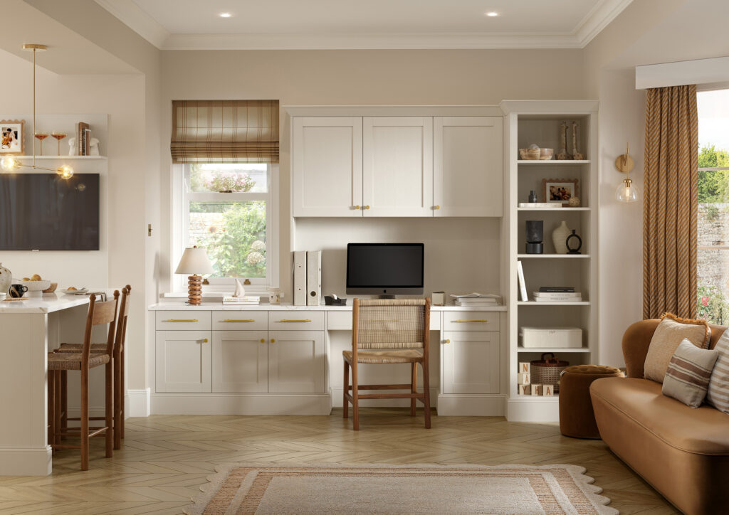 Built-in home office storage and desk area finished in matching taupe shaker cabinetry.