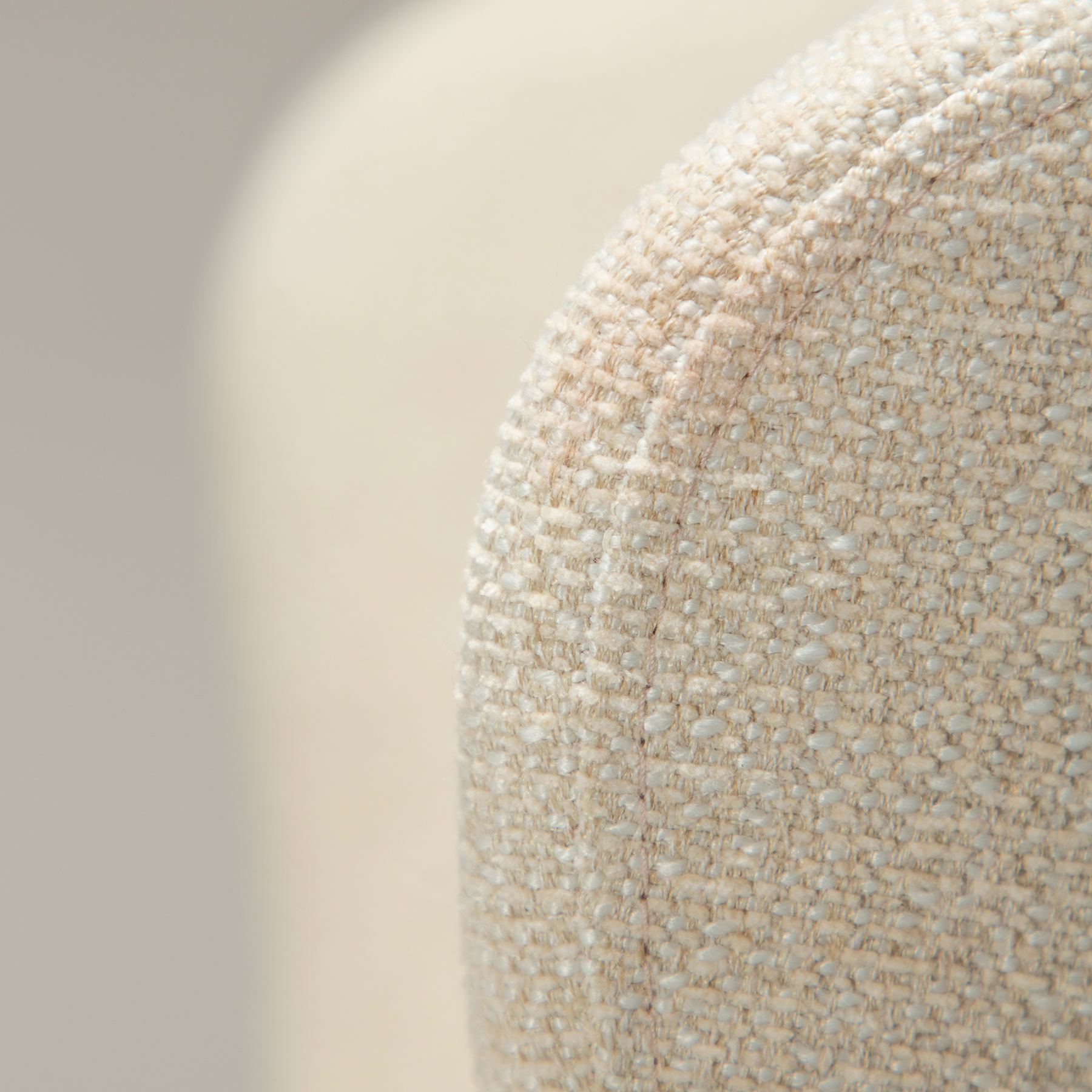 glam-chair-swivel-simply-beige-boucle-w-chrome-swivel-legs_100208323-07-detail2 Fabric detail on the glam chair swivel in simply beige boucle fabric with chrome legs.