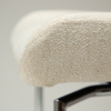 glam-chair-swivel-simply-beige-boucle-w-chrome-swivel-legs_100208323-08-detail3 Close up of the fabric detail of the glam chair swivel in simply beige boucle fabric with chrome legs.