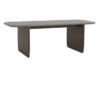Howitt walnut oak rectangular dining table with bold panel legs, softened edges, and visible wood grain detail on a white background.
