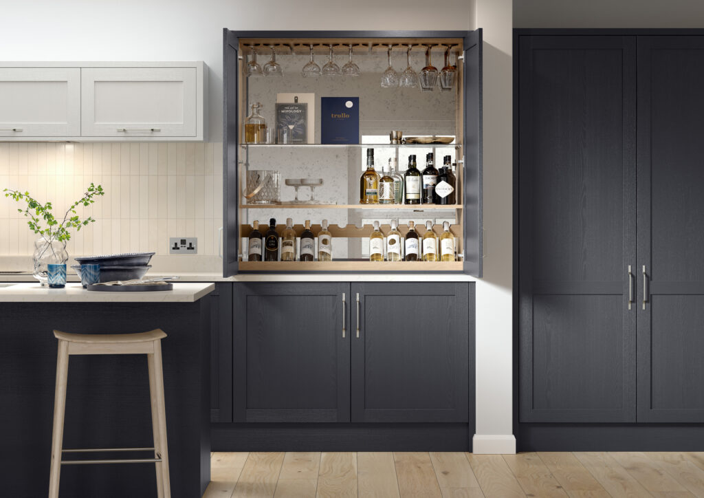 Bespoke navy shaker kitchen with integrated drinks cabinet and wine storage.