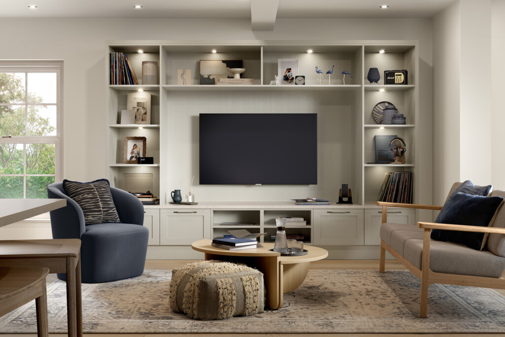 Open plan kitchen and living room with bespoke media wall and fitted storage.