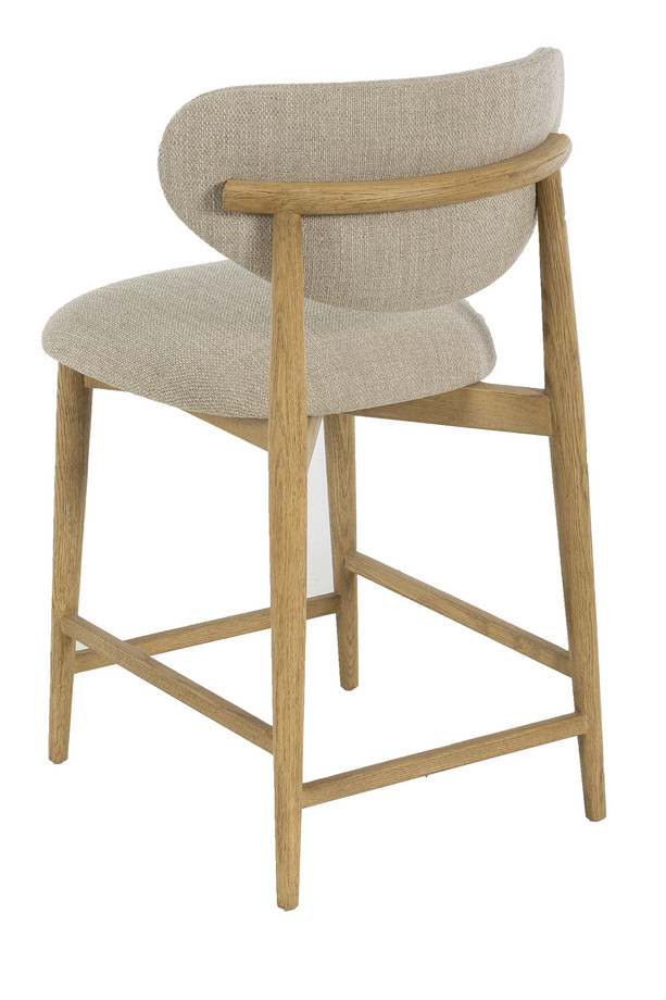 Arden light grey upholstered counterstool with a natural wooden frame, padded seat, rounded backrest, and built-in footrest.