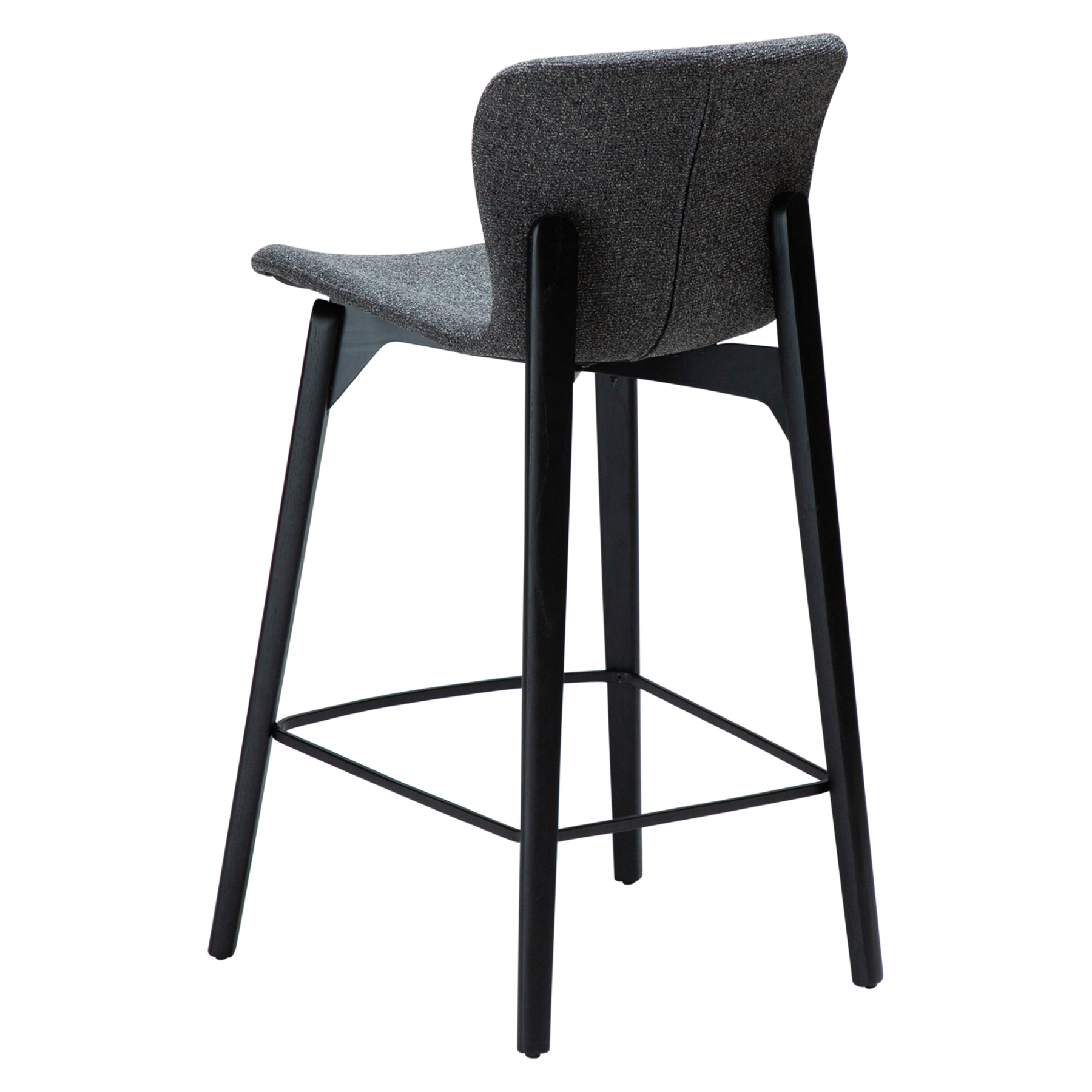 paragon-counter-stool-pebble-grey-fabric-black-stained-ash-legs-angled Paragon counter stool upholstered in Pebble Grey fabric with black-stained ash wood legs, featuring a curved seat and backrest for modern kitchen islands and breakfast bars.