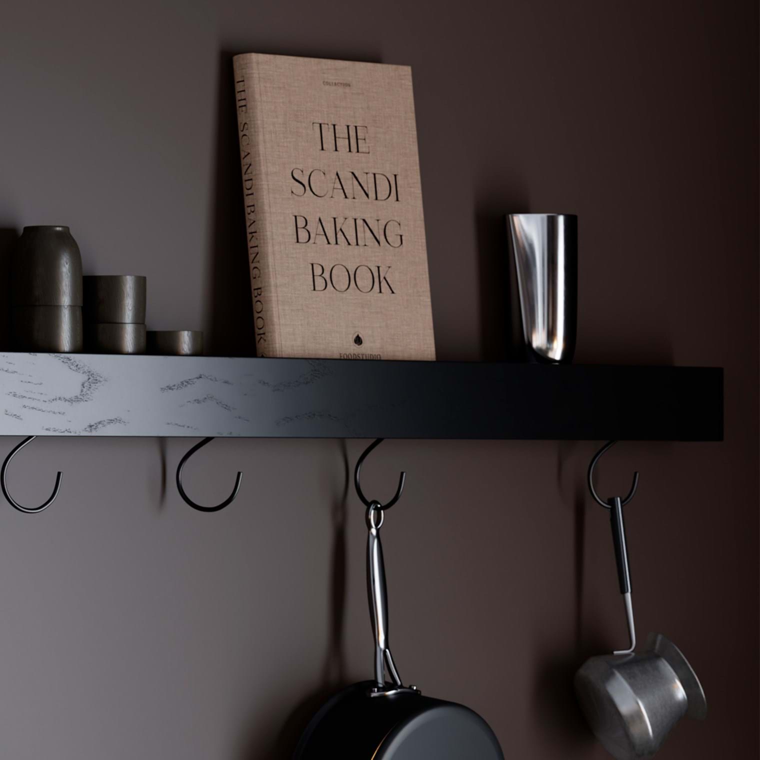 Protopia wall shelf in black stained ash veneer with a slim profile and curved ends, ideal for displaying books, artwork, photographs, and decorative accessories in modern interiors.